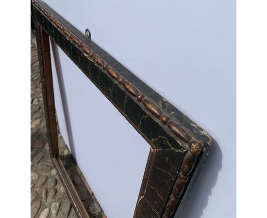 Carved, lacquered, and faux marble painted wooden frame. Italy, 18th century.