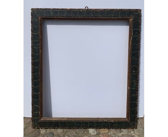 Carved, lacquered, and faux marble painted wooden frame. Italy, 18th century.