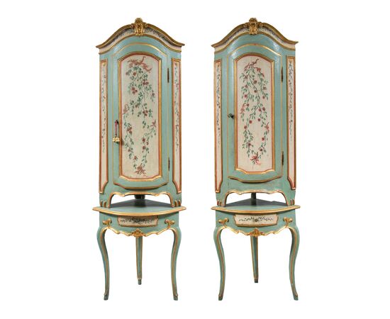 Pair of carved, lacquered and painted wooden corner cabinets. Piedmont, 18th century.