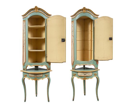 Pair of carved, lacquered and painted wooden corner cabinets. Piedmont, 18th century.