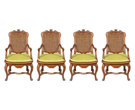 Four carved wooden armchairs. Lombardy, mid-18th century.