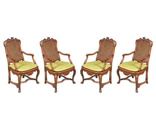 Four carved wooden armchairs. Lombardy, mid-18th century.