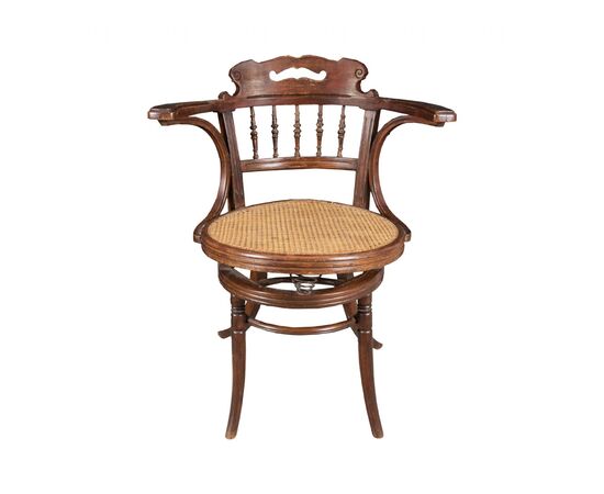 Carved wooden office armchair. Likely manufactured by Thonet - Vienna, early 20th century. Carved wooden office armchair. Likely manufactured by Thonet - Vienna, early 20th century.