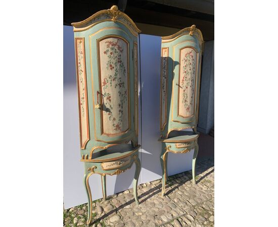 Pair of carved, lacquered and painted wooden corner cabinets. Piedmont, 18th century.