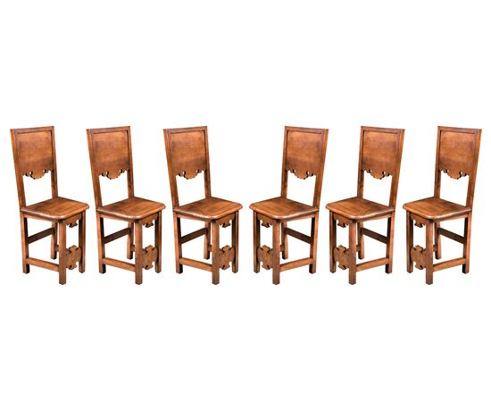Six friar chairs in solid walnut. Friuli, 17th century.