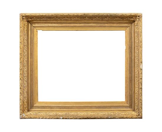 Carved and gilded wooden frame with pastiglia reliefs. Italy, late 19th century.
