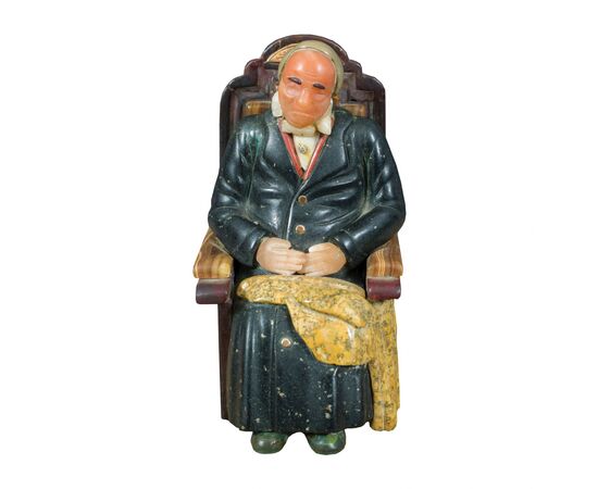 Small sculpture in various marbles and hard stones - Seated old man. Probably Russia, 19th-20th century.
