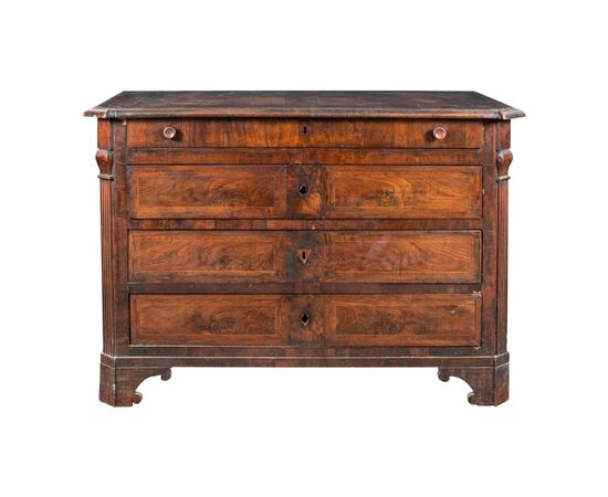 Walnut feather chest of drawers. Italy, early 19th century.