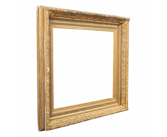 Carved and gilded wooden frame with pastiglia reliefs. Italy, late 19th century.