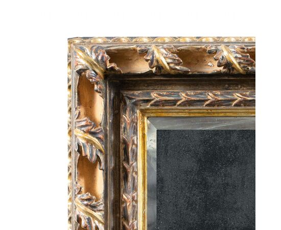 Liberty mirror in carved and gilded wood. Italy, 20th century.