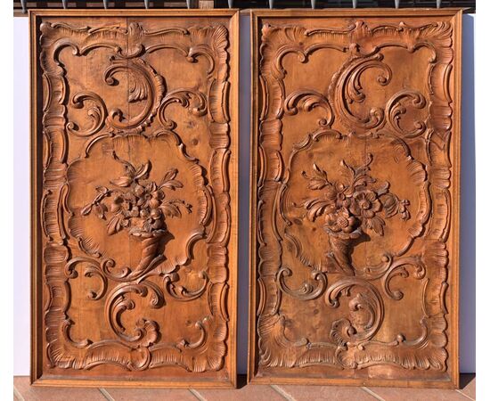 Pair of carved wooden wall panels. Italy, first half of the 20th century.