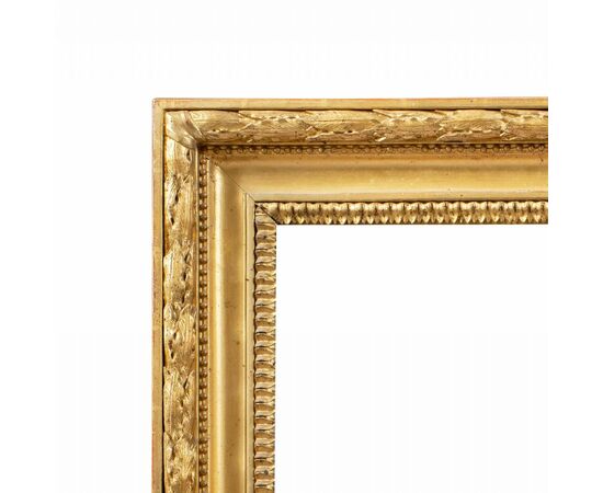 Empire style frame in carved and gilded wood. Italy, 19th century.