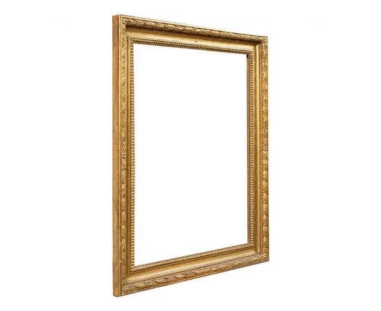 Empire style frame in carved and gilded wood. Italy, 19th century.