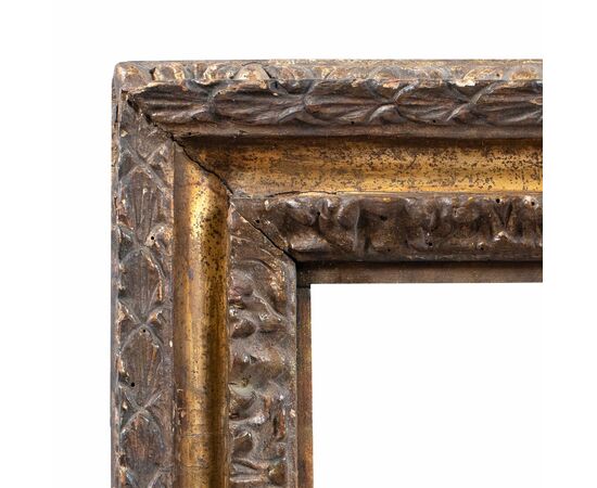 Carved and mecca-gilded wooden frame. Rome, late 17th century.