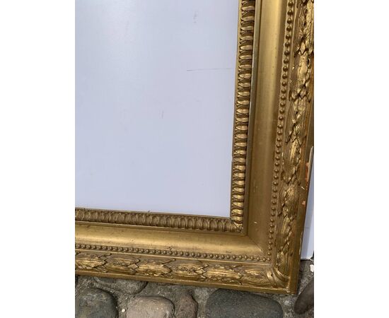 Empire style frame in carved and gilded wood. Italy, 19th century.
