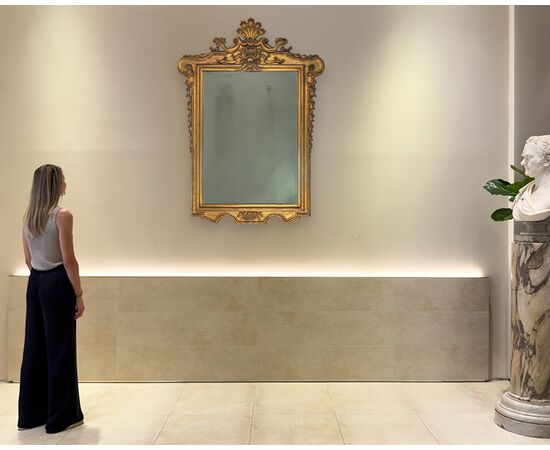 Carved and gilded wooden mirror, 19th century