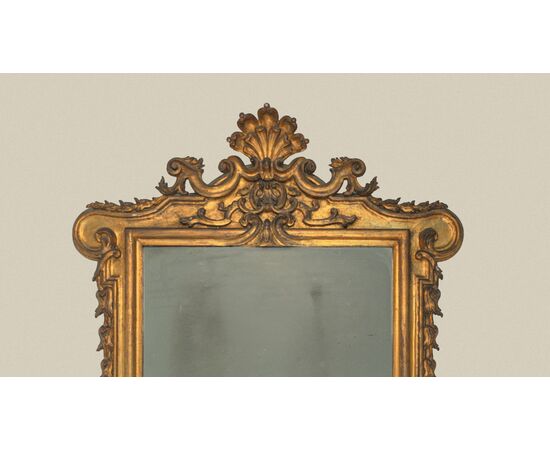 Carved and gilded wooden mirror, 19th century
