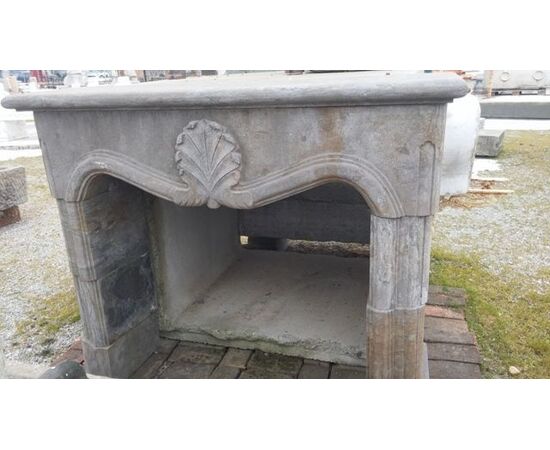 18th-century style stone fireplace