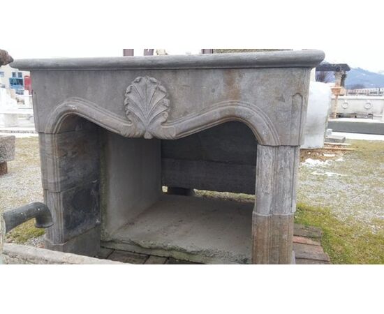 18th-century style stone fireplace