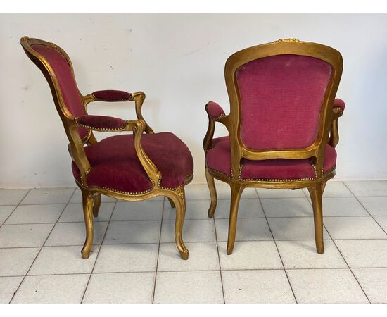 Pair of carved and gilded wooden armchairs. Lombardy, 19th century