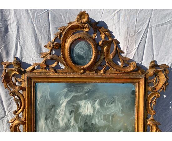Carved and gilded wood mirror. Venice, 18th century.