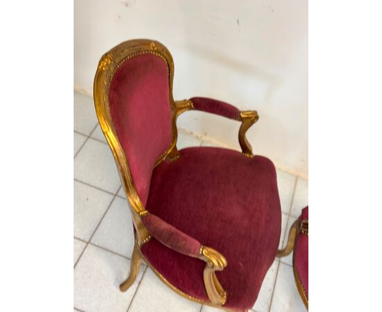Pair of carved and gilded wooden armchairs. Lombardy, 19th century