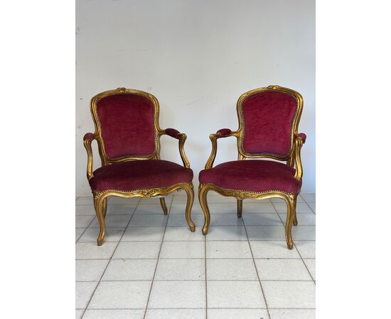Pair of carved and gilded wooden armchairs. Lombardy, 19th century
