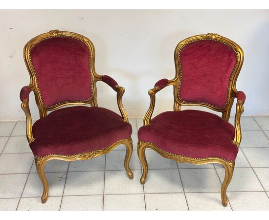 Pair of carved and gilded wooden armchairs. Lombardy, 19th century