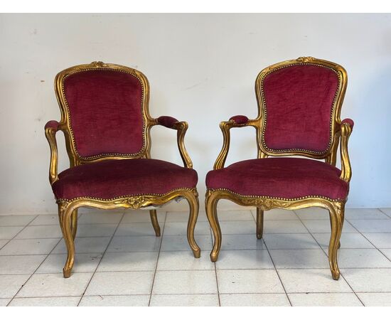 Pair of carved and gilded wooden armchairs. Lombardy, 19th century