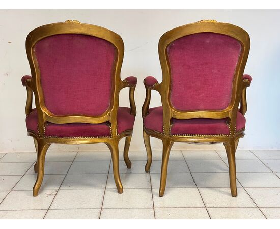Pair of carved and gilded wooden armchairs. Lombardy, 19th century