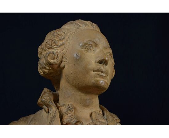 Pair of 19th-century French terracotta busts resting on circular marble bases, signed on the back.
