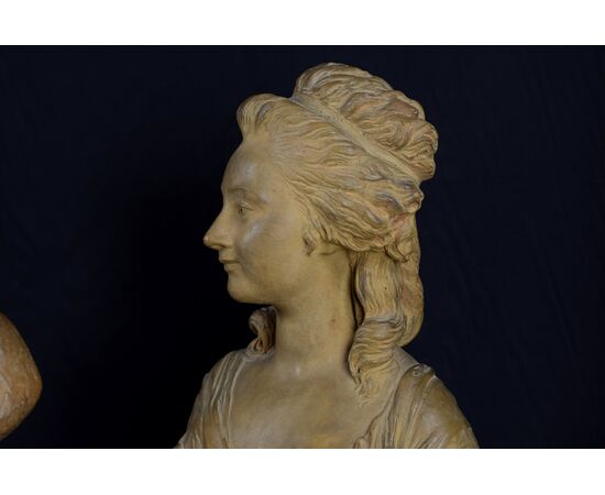 Pair of 19th-century French terracotta busts resting on circular marble bases, signed on the back.