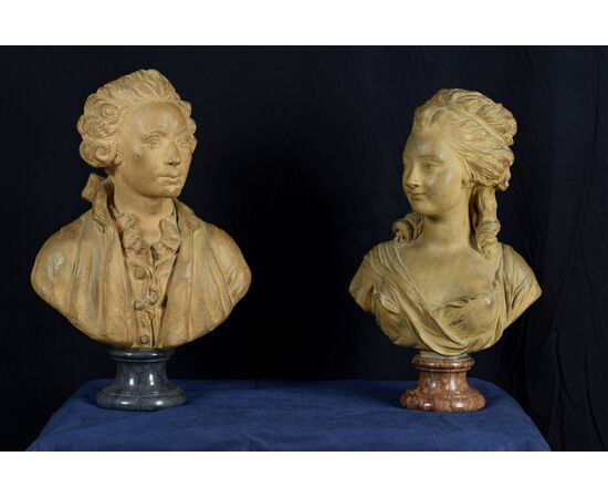 Pair of 19th-century French terracotta busts resting on circular marble bases, signed on the back.