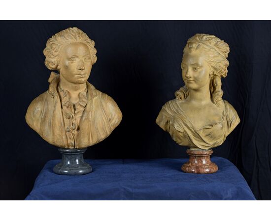 Pair of 19th-century French terracotta busts resting on circular marble bases, signed on the back.