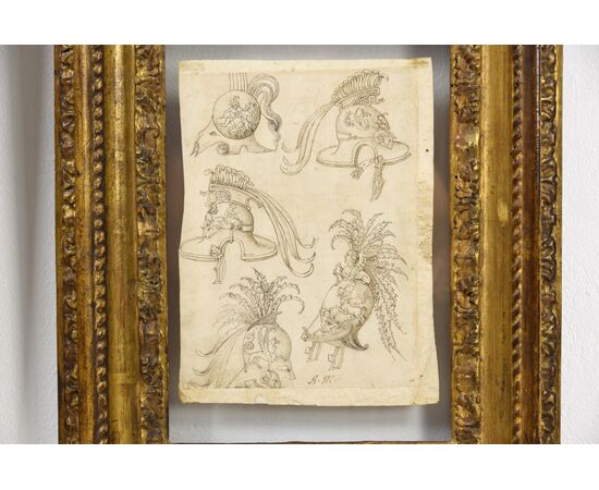 Coppia di disegni a china su carta con studi per grottesche, fregi ed elmi. Pittore del centro Italia del XVII secolo Coppia di disegni a china su carta con studi per grottesche, fregi ed elmi. Pittore del centro Italia del XVII secolo