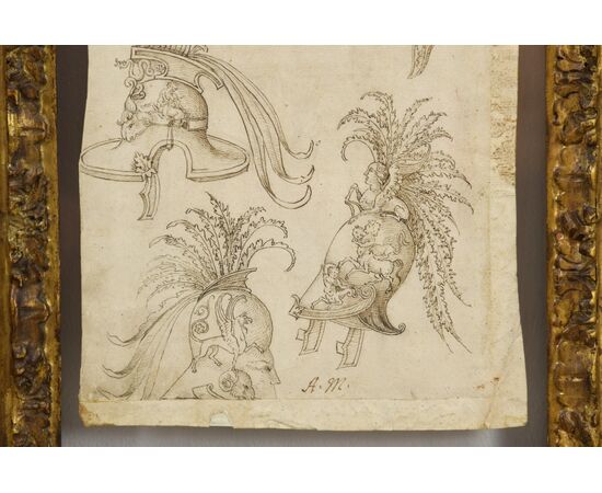 Coppia di disegni a china su carta con studi per grottesche, fregi ed elmi. Pittore del centro Italia del XVII secolo Coppia di disegni a china su carta con studi per grottesche, fregi ed elmi. Pittore del centro Italia del XVII secolo