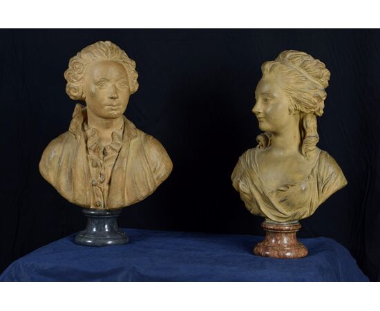 Pair of 19th-century French terracotta busts resting on circular marble bases, signed on the back.