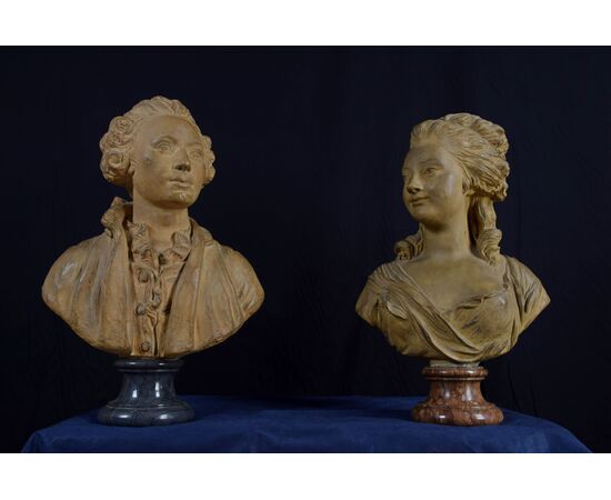 Pair of 19th-century French terracotta busts resting on circular marble bases, signed on the back.