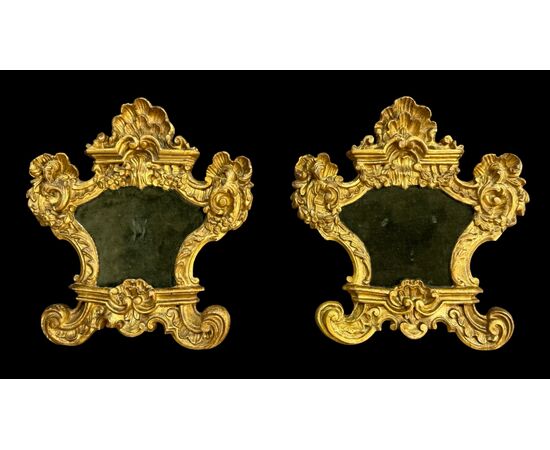 Pair of carved wooden cartaglorias with gold leaf.