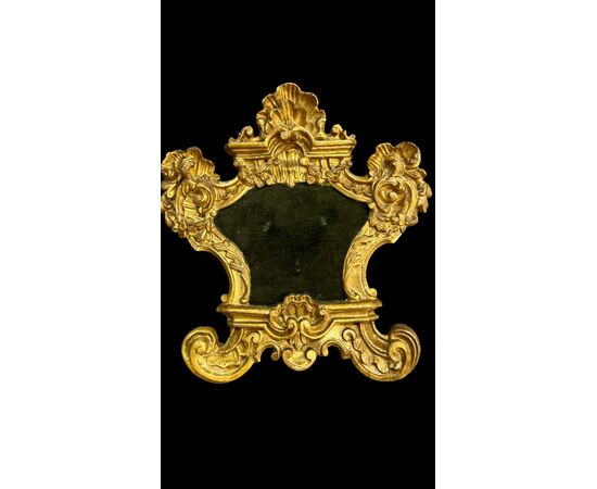 Coppia di cartaglorie in legno intagliato e foglia oro.