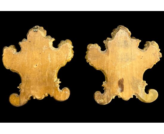 Pair of carved wooden cartaglorias with gold leaf.