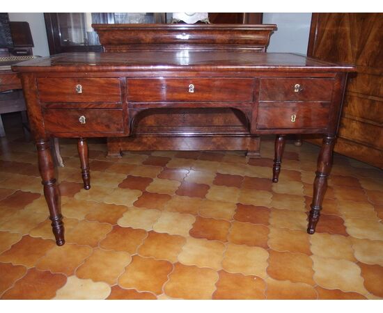 Flame mahogany center desk, mid-19th century Empire style, cm L129xP67xH80