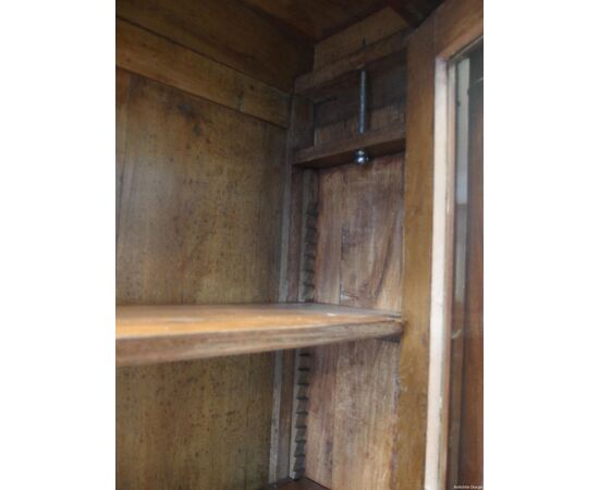 Mahogany bookcase with two doors and solid columns in Empire style from the early 1800s, dimensions: L148xW45xH228 cm.