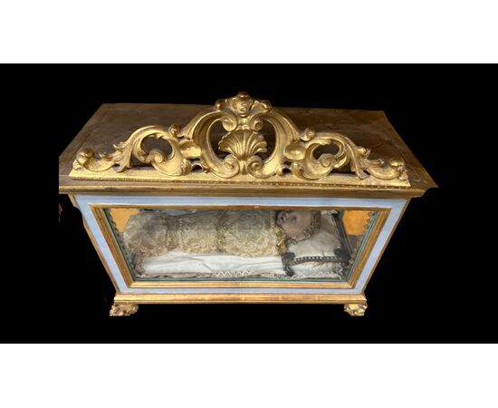 Scultura in cera Gesu’bambino entro teca.