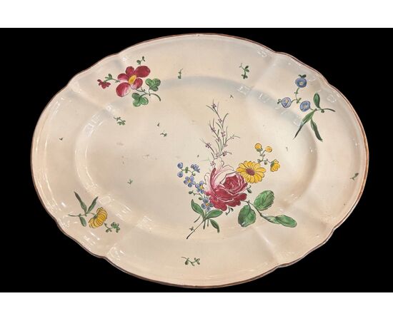 Oval majolica plate decorated with a 'rose' design. Finck Manufacture. Bologna.