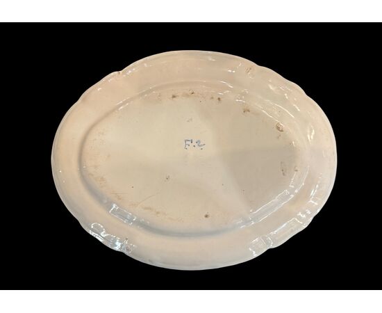 Oval majolica plate decorated with a 'rose' design. Finck Manufacture. Bologna.