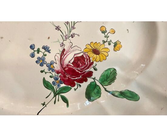 Oval majolica plate decorated with a 'rose' design. Finck Manufacture. Bologna.
