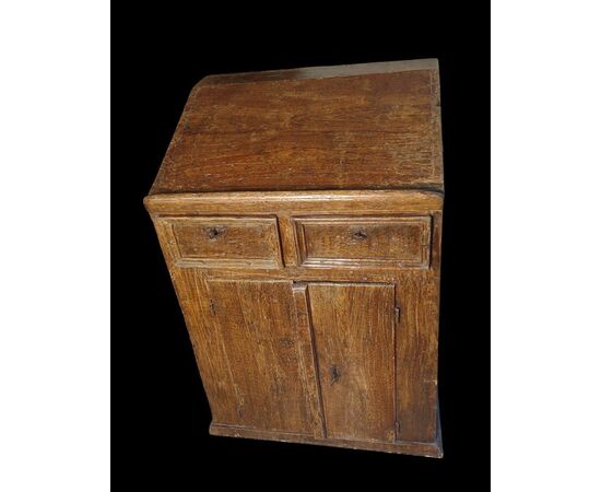 Small writing desk painted to look like wood.