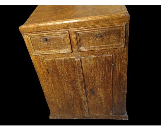 Small writing desk painted to look like wood.