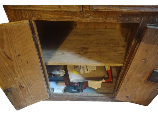 Small writing desk painted to look like wood.